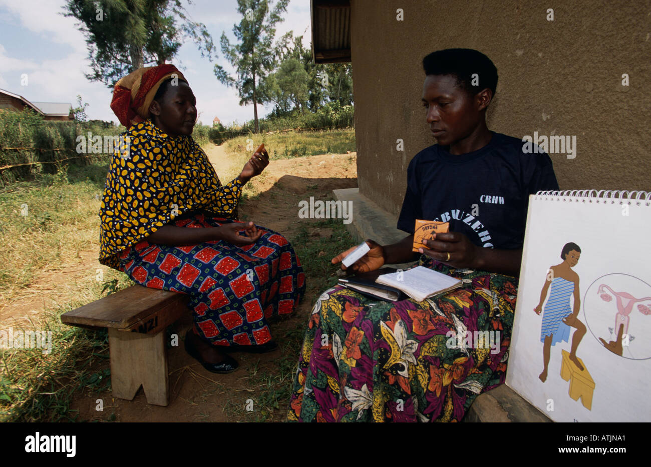 Volunteer introduces African woman to contraception, Uganda Stock Photo