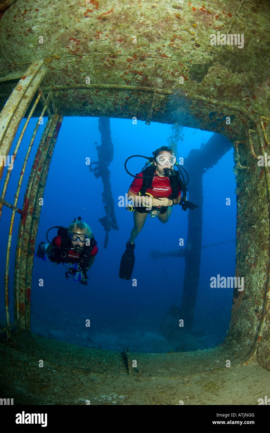 Scuba diver in shipwreck in the Caribbean, St, Statia, ocean, sea, scuba, diving, blue water, kids, teenagers, underwater Stock Photo