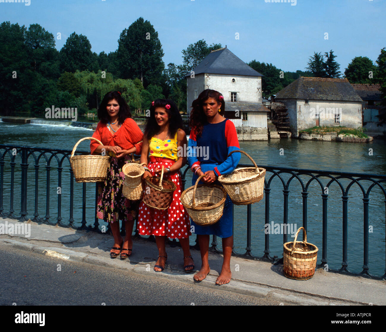 Three gitanes (gypsies) selling baskets, France. Stock Photo
