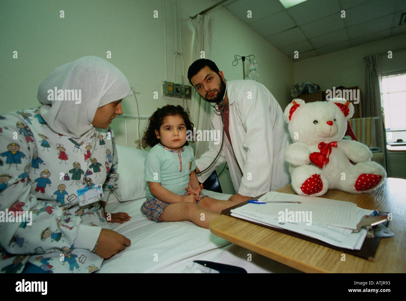 A doctor examines a young patient at a hospital in Beirut Lebanon Stock
