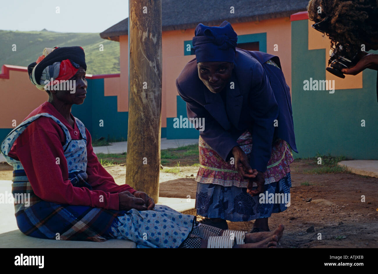 Tourist photographing locals in traditional attire and accessories, Natal, South Africa Stock Photo