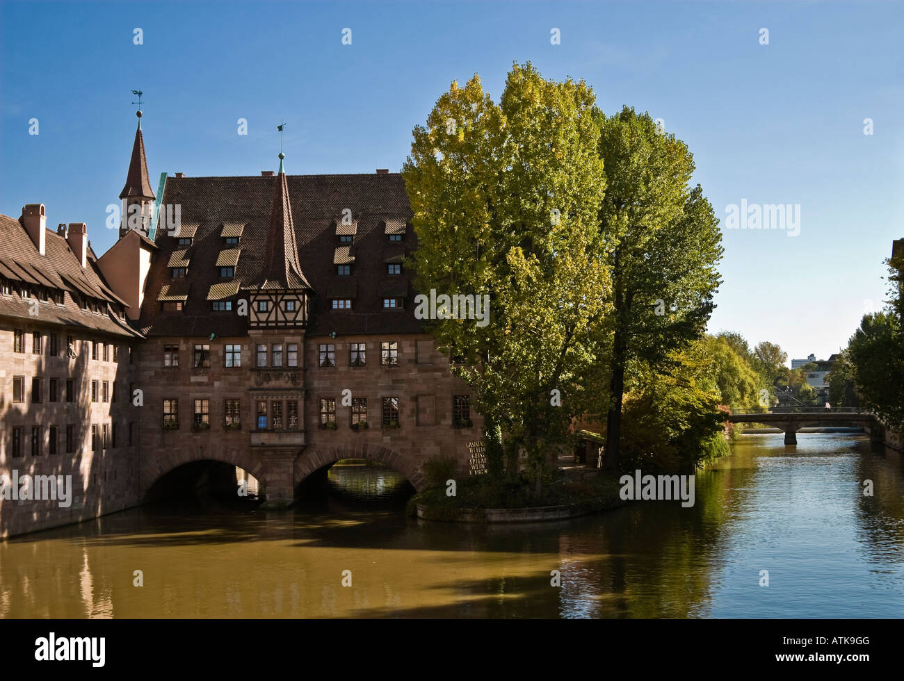 Scenic view, buildings on Pegnitz River, Nuremberg, Germany. Heilig-Geist-Spital - former 15th century hospital. Stock Photo