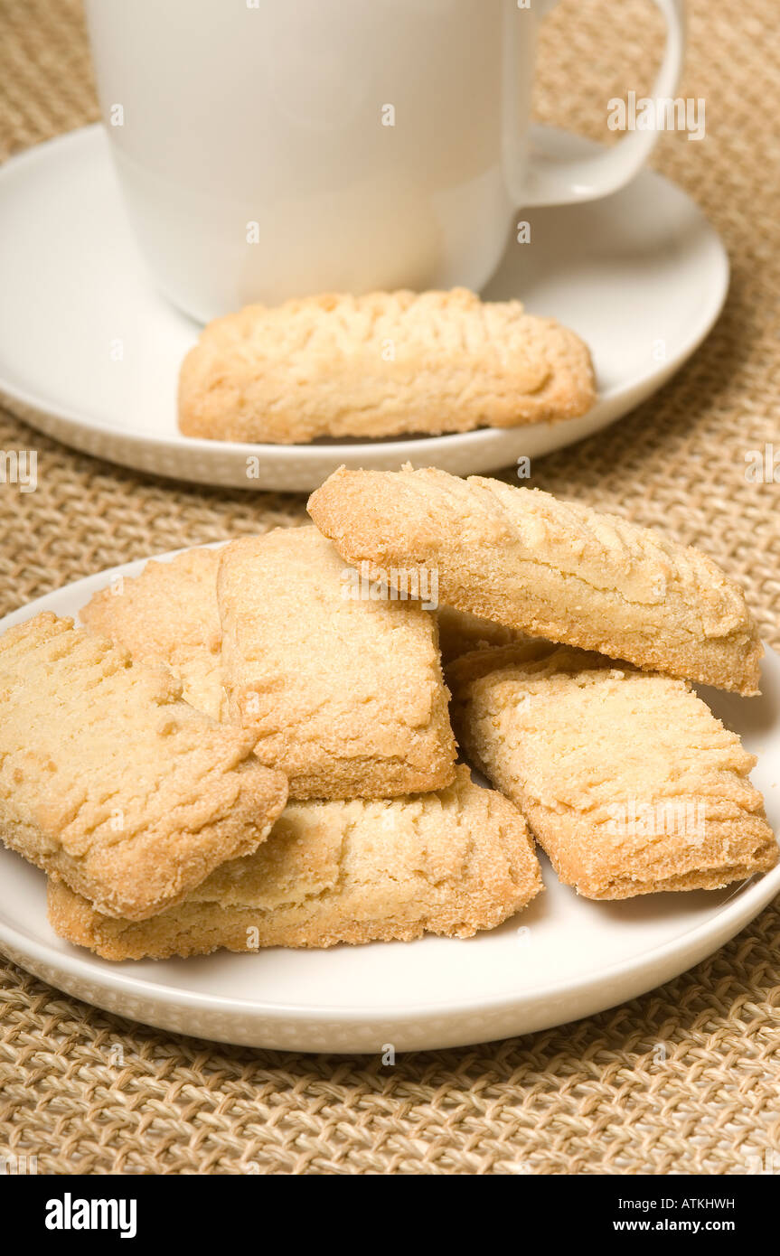 Scottish shortbread biscuits with cup and saucer in background close up Stock Photo