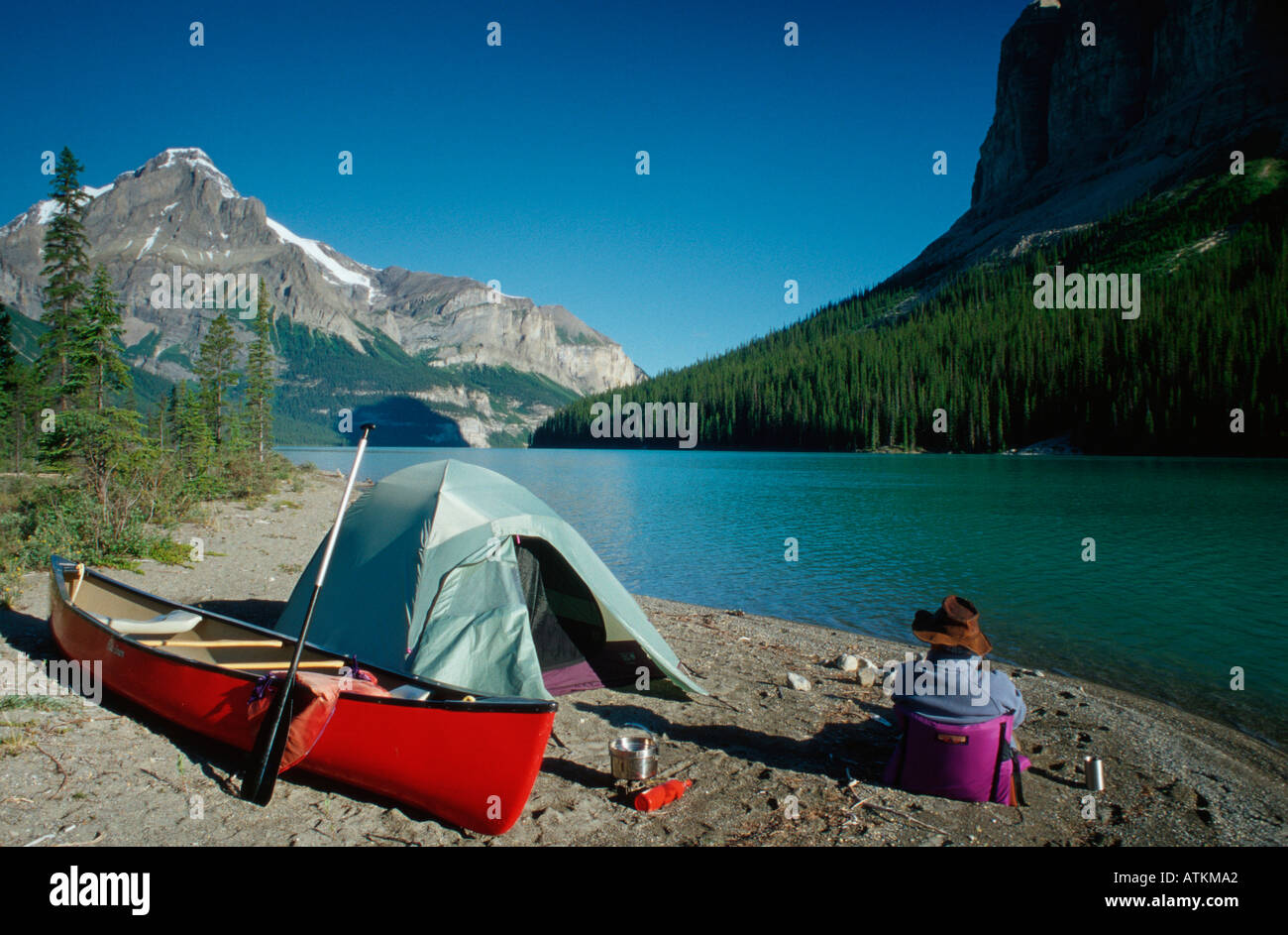 Man with tent at Maligne Lake / Mann mit Zelt am Maligne-See Stock Photo