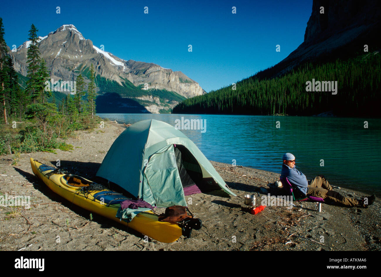 Man with tent at Maligne Lake / Mann mit Zelt am Maligne-See Stock Photo