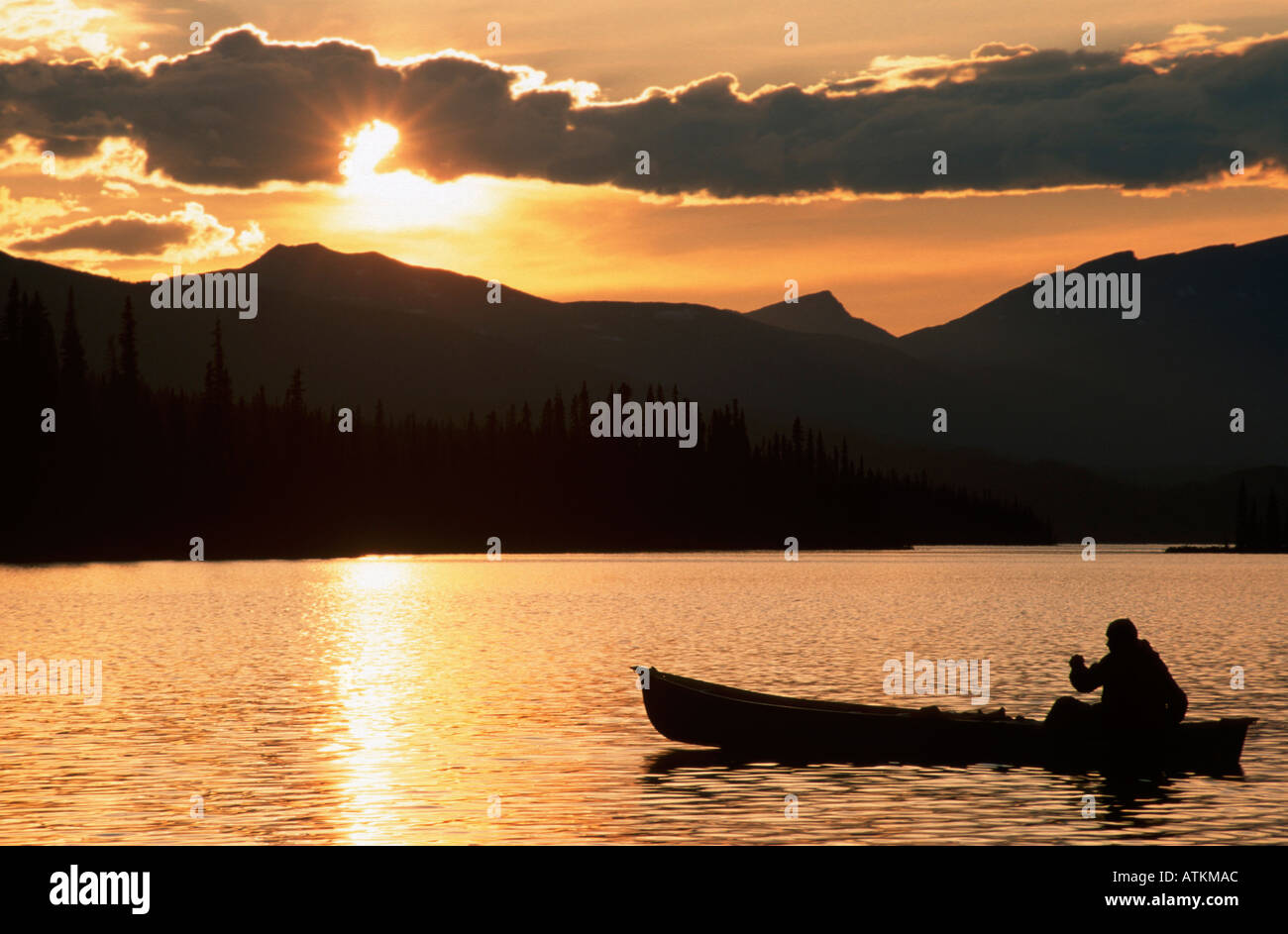 Canoe at sunset / Kanu bei Sonnenuntergang Stock Photo