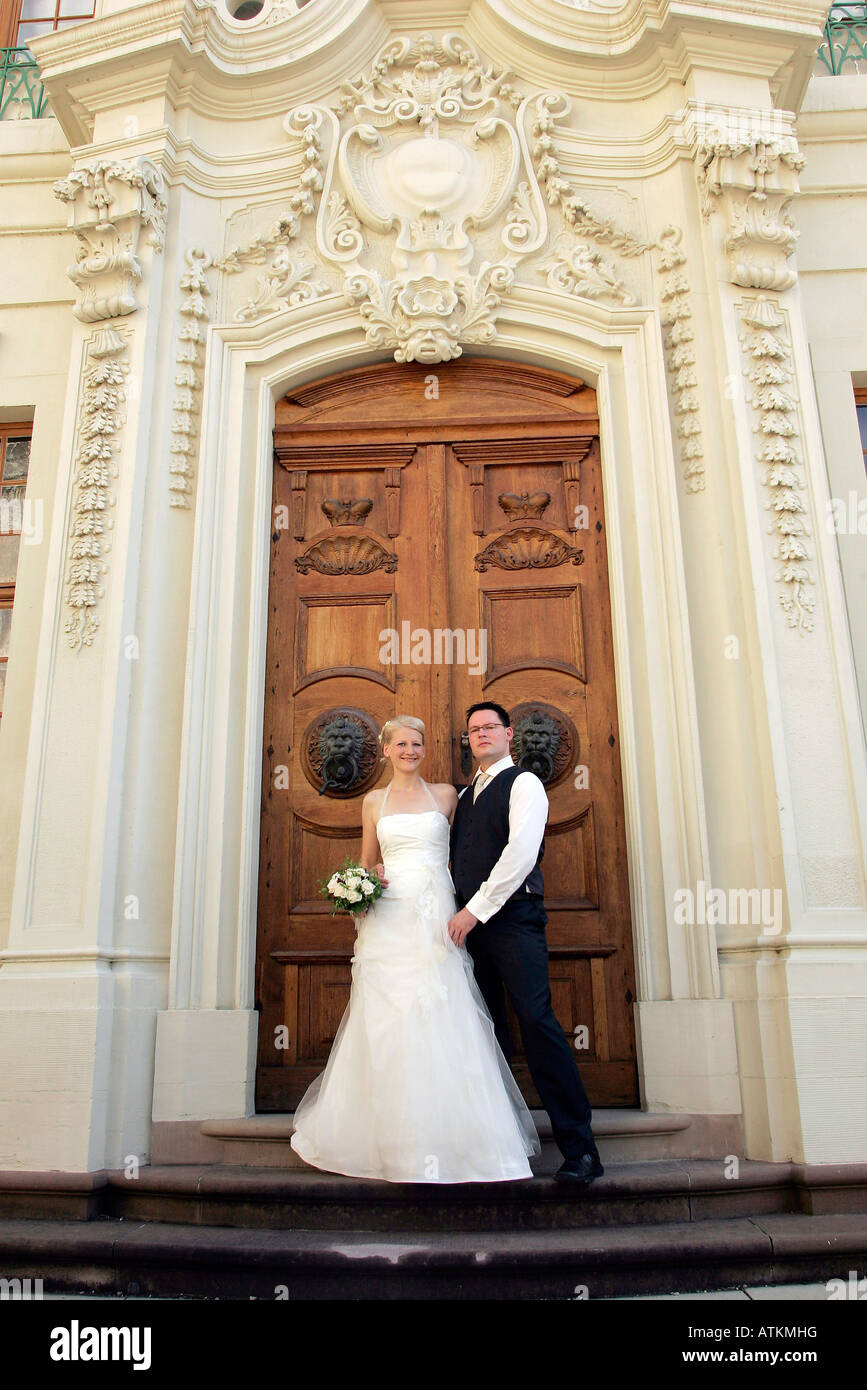 wedding couple in front of a castle Stock Photo - Alamy