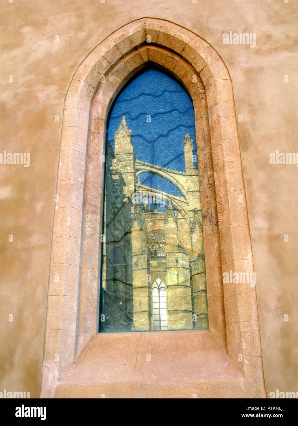 Reflection of Palma Cathedral seen in an upright narrow window, Mallorca, Spain Stock Photo