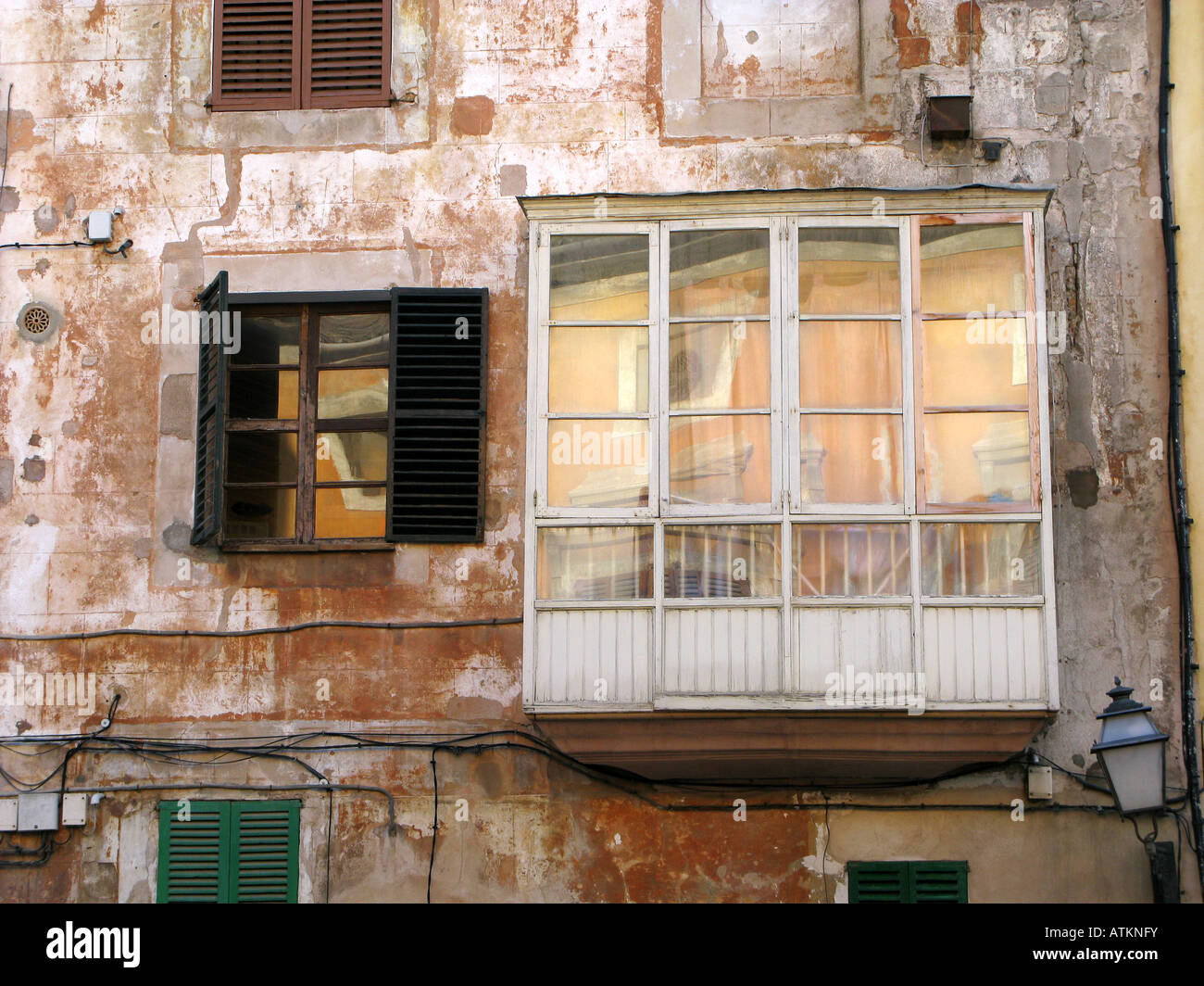 Shambolic old enclosed balcony and windows. Palma. Mallorca, Spain Stock Photo