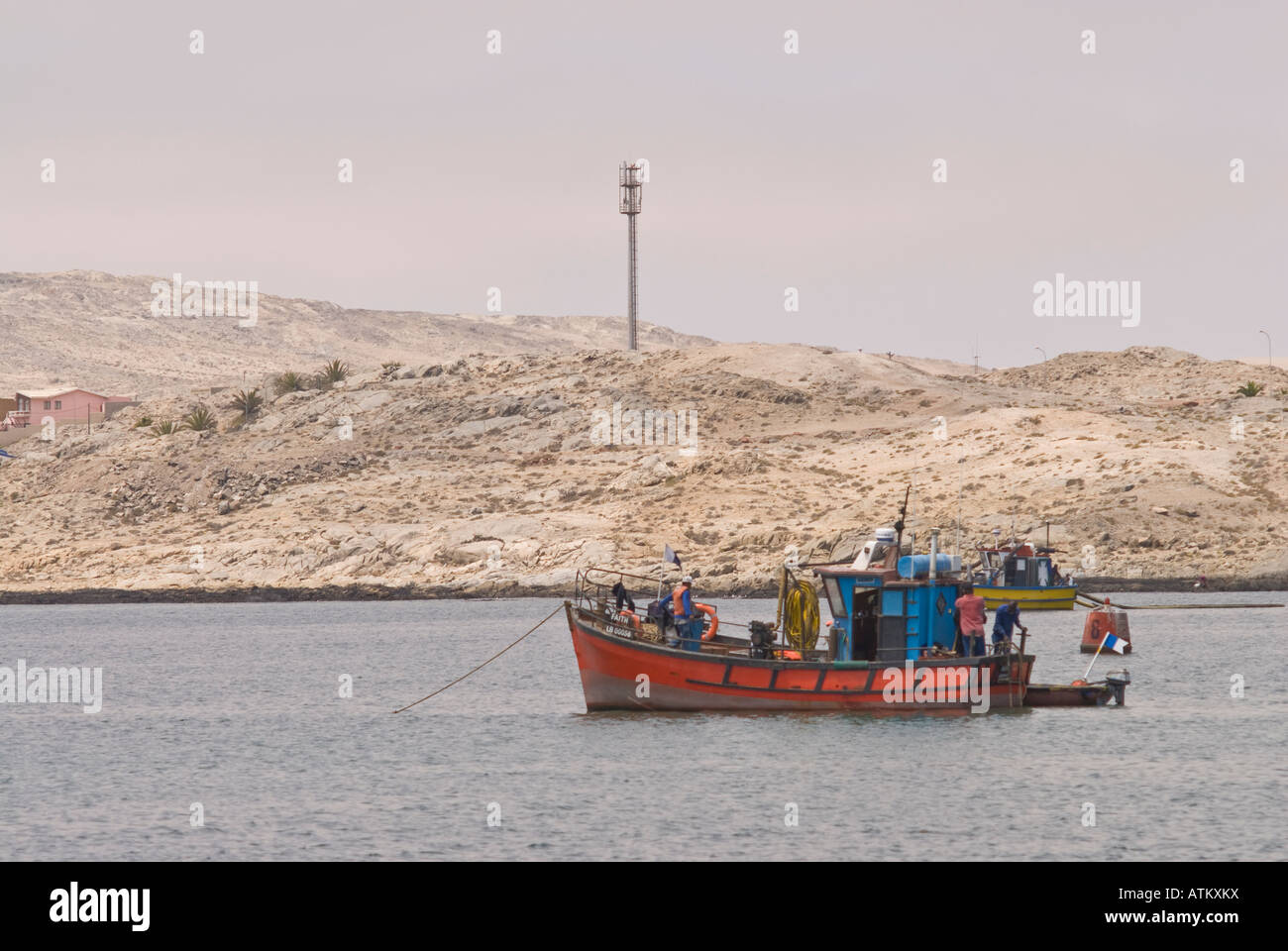 Fishing boats in the Luderitz harbour in Namibia Stock Photo