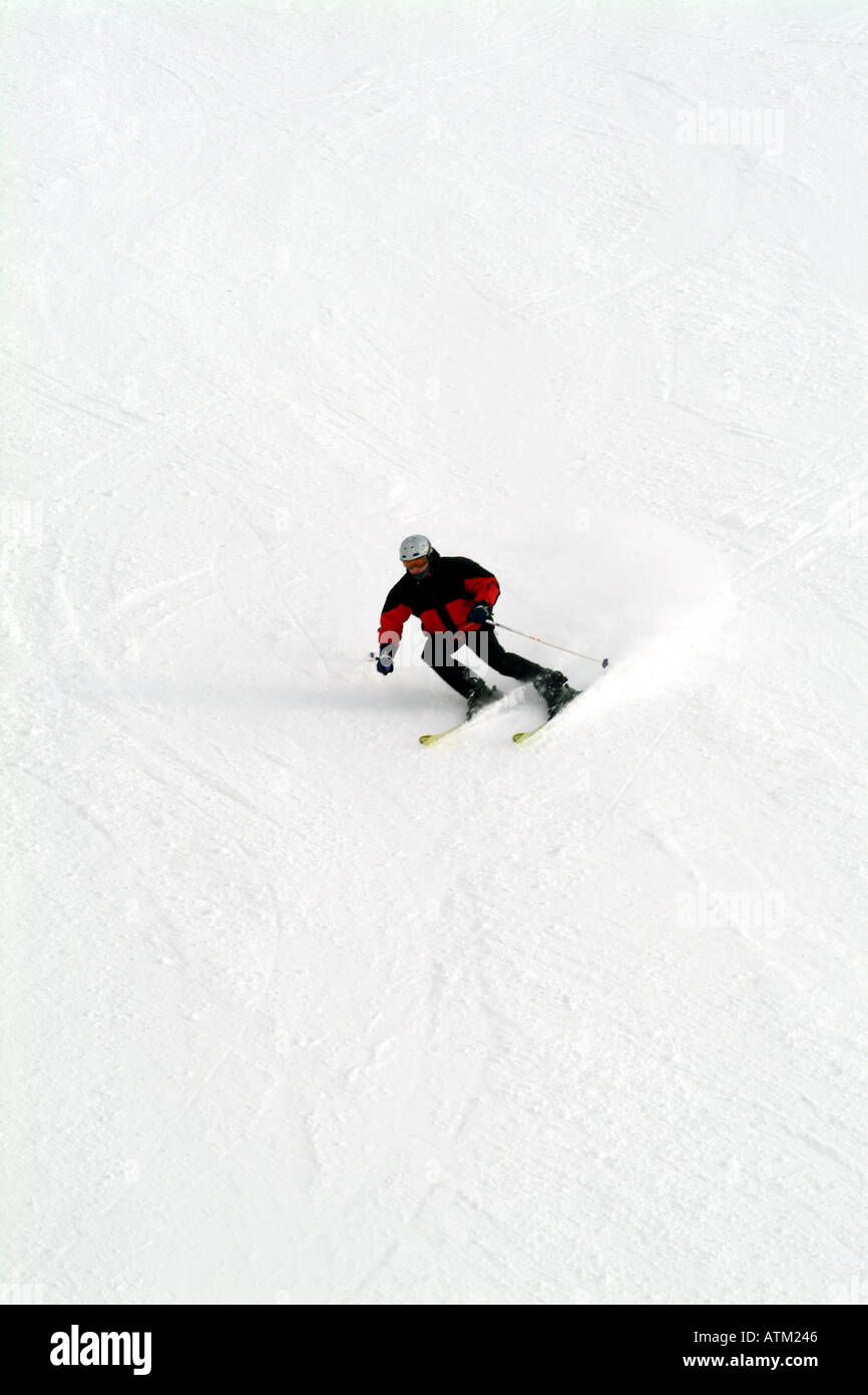 Skiers snowboarders skiing snowboarding on the pistes of the Schmittenhohe mountain above Zell am See  Stock Photo