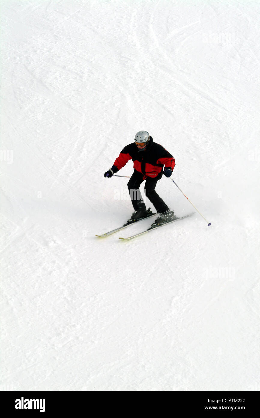 Skiers snowboarders skiing snowboarding on the pistes of the Schmittenhohe mountain above Zell am See  Stock Photo