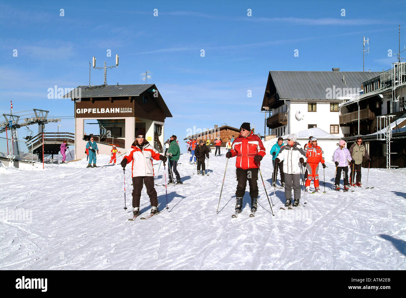 Skiers on the summit of Schmittenhohe mountain above Zell am See  Stock Photo