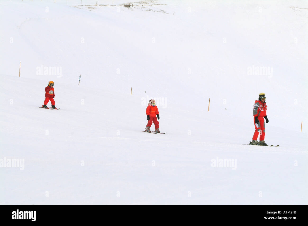 Children getting ski instruction on the pistes of the Schmittenhohe mountain above Zell am See  Stock Photo