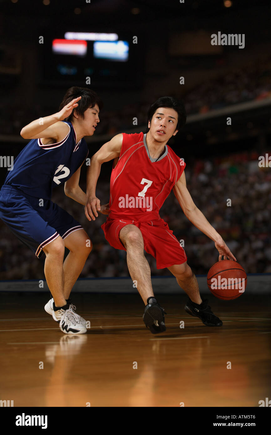 Two young Asian basketball players competing Stock Photo Alamy