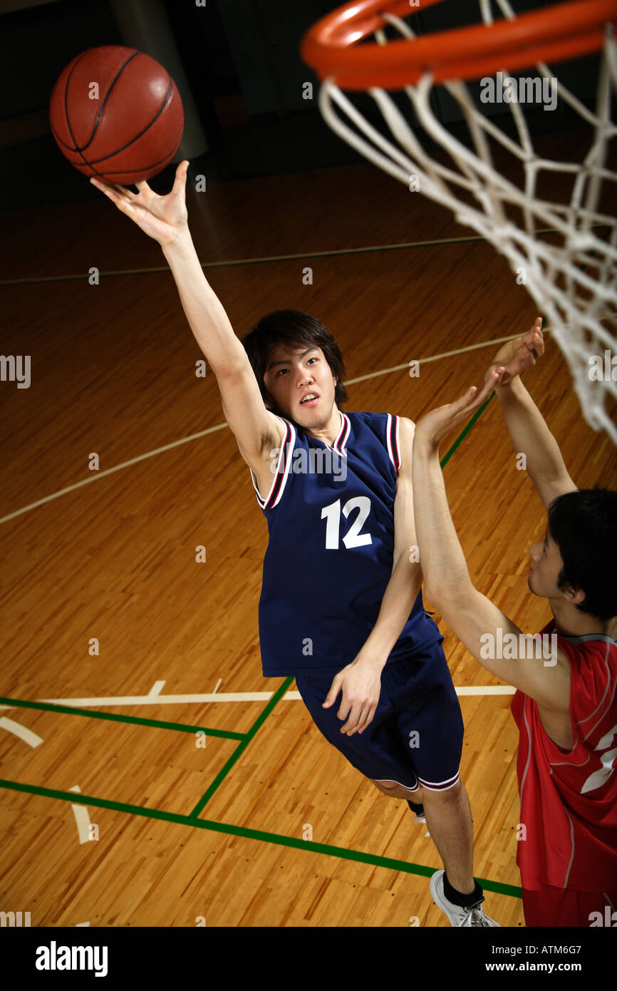 Young Asian basketball players on court Stock Photo Alamy