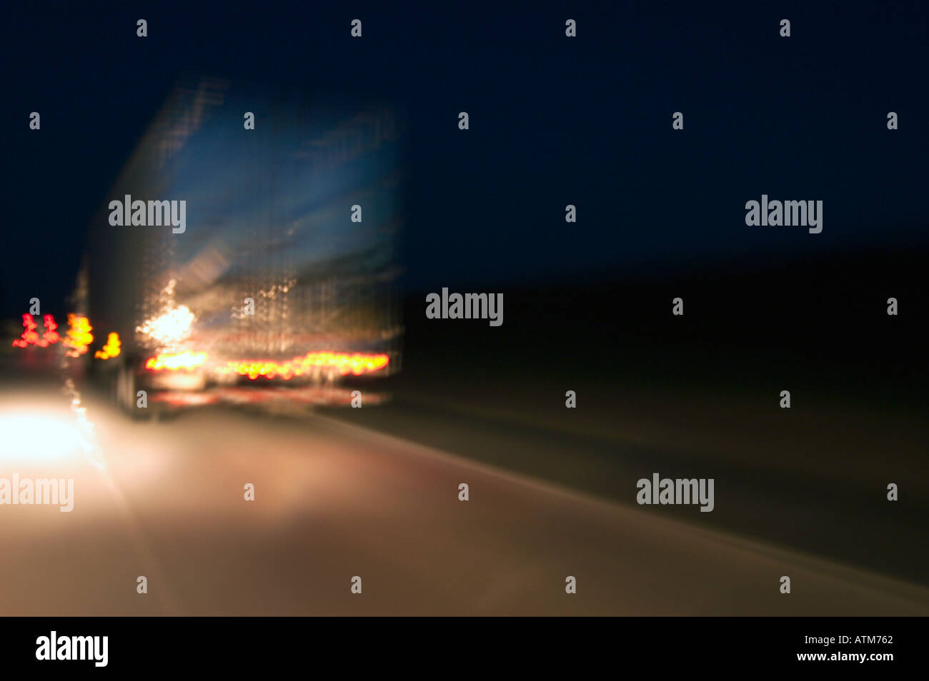truck on highway at night Stock Photo