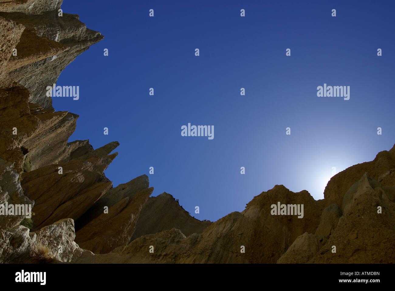 Ahuriri clay cliffs outlined against deep blue sky Stock Photo