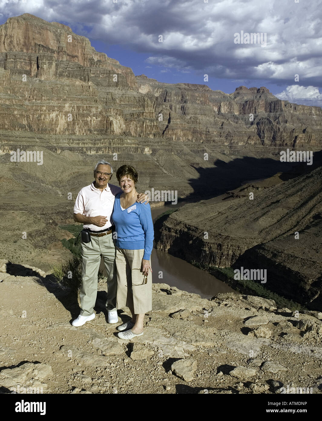 Happy pensioners on holiday visit pose for photograph in Grand Canyon United States Stock Photo