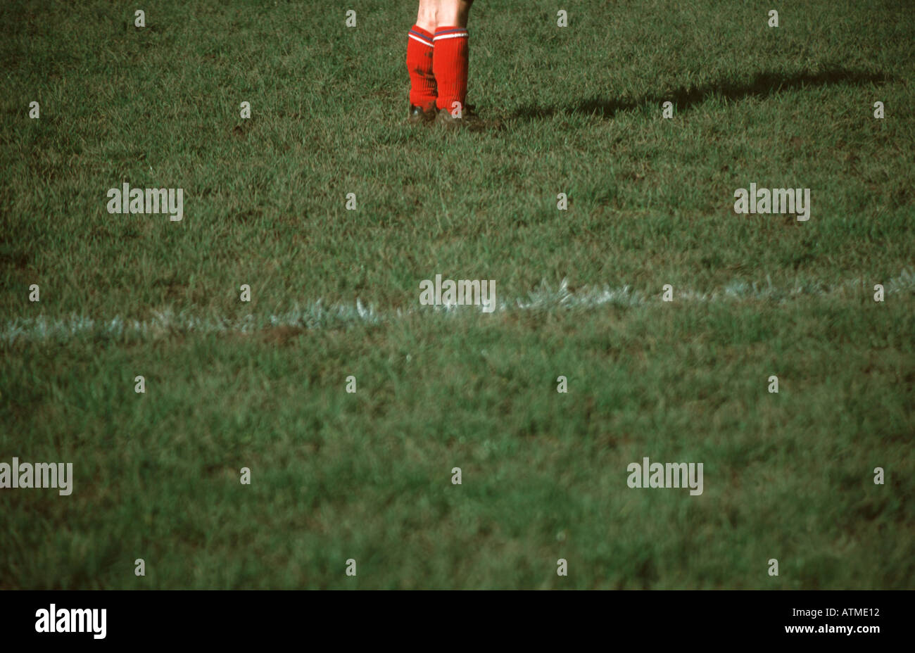 Red socks of a football player Stock Photo Alamy