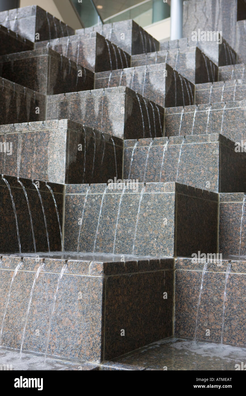 A cascading water fountain in an office building Stock Photo Alamy