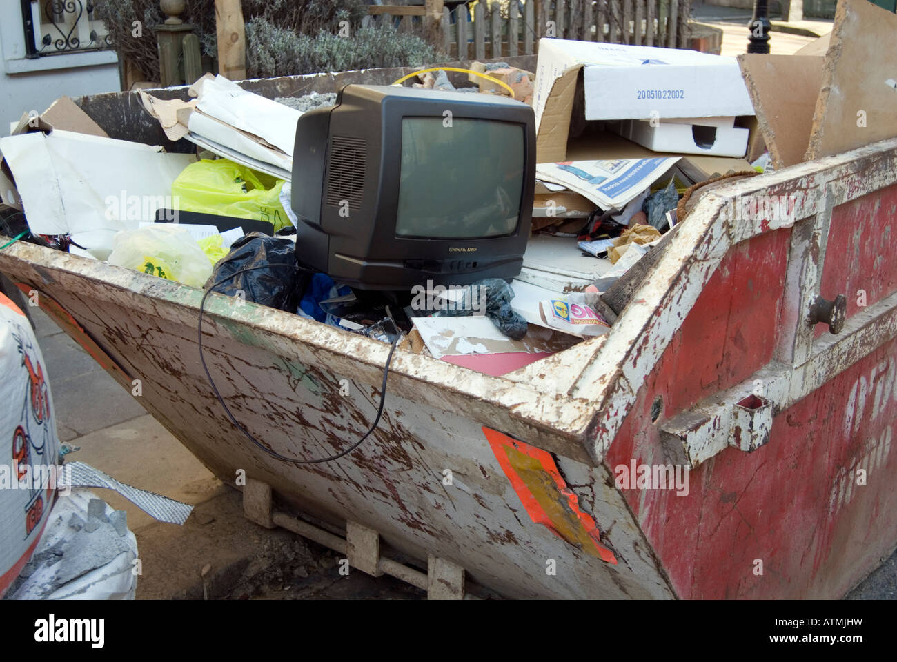 Old television dumped in skip, England UK Stock Photo Alamy