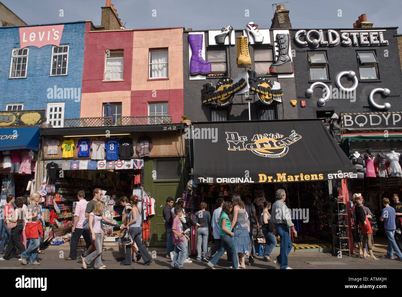 People Walk Along Past The Doctor Martins Shop On Camden Town High Stock Photo Alamy