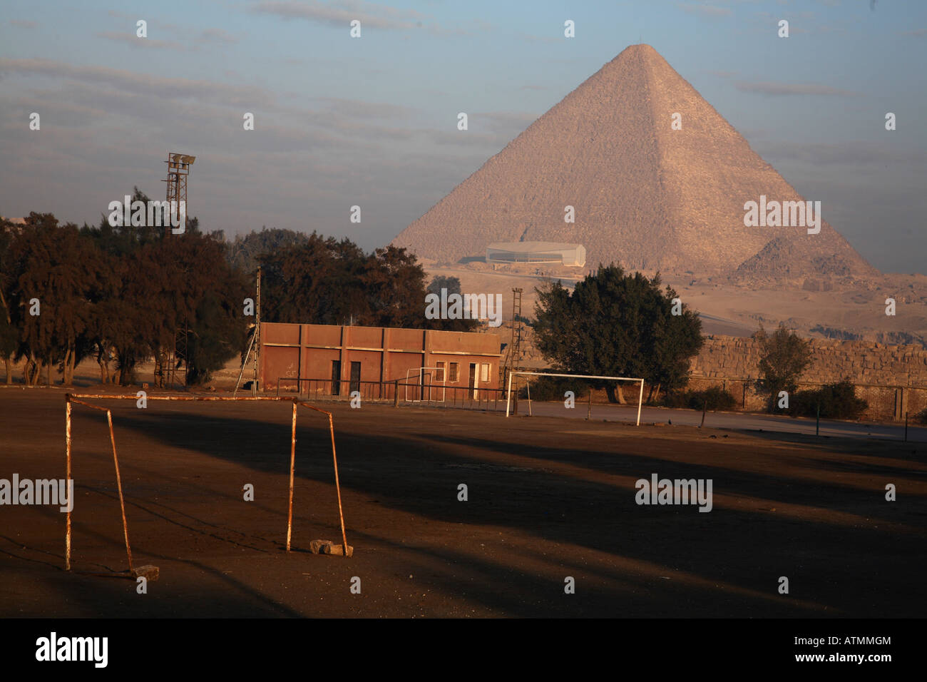The Keops Pyramid in sun light with school grounds in the fore ground. Stock Photo