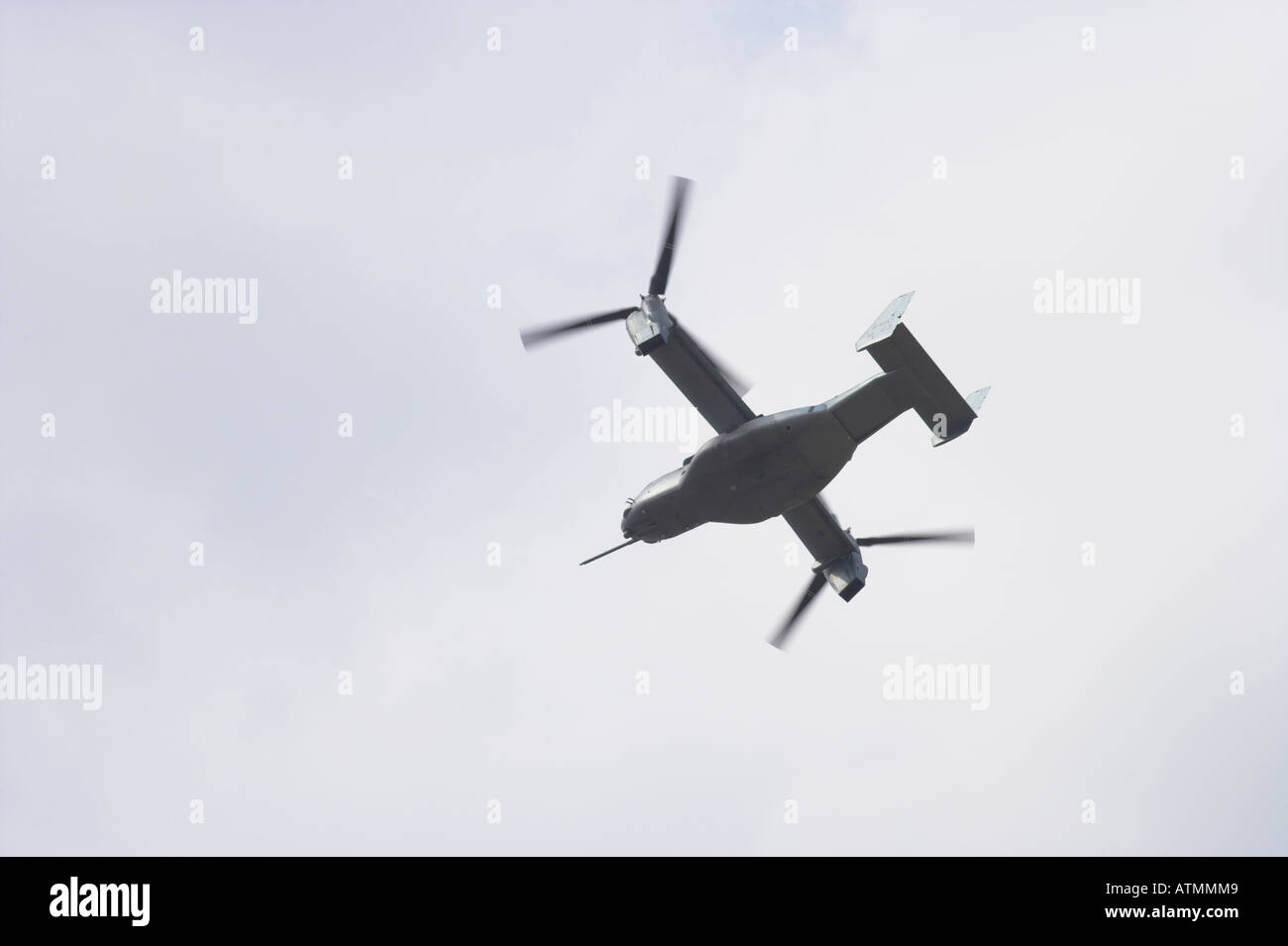 Osprey V22 slowly turning away while hovering Stock Photo
