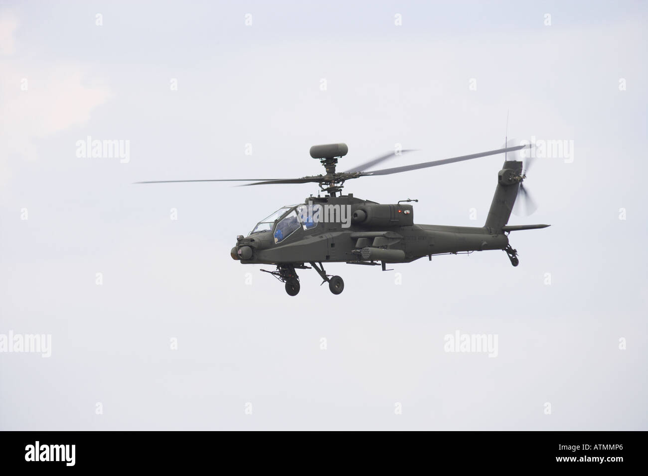 Apache helicopter AH64D Longbow in flight port broadside Stock Photo