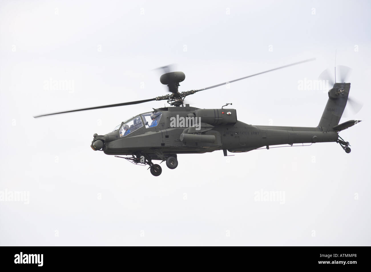 Apache helicopter AH-64D Longbow in flight port broadside Stock Photo