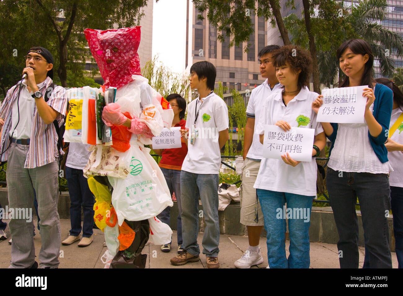 HONG KONG CHINA - Plastic Bag Man and students during environmental pollution protest. The Green Student Council. Stock Photo