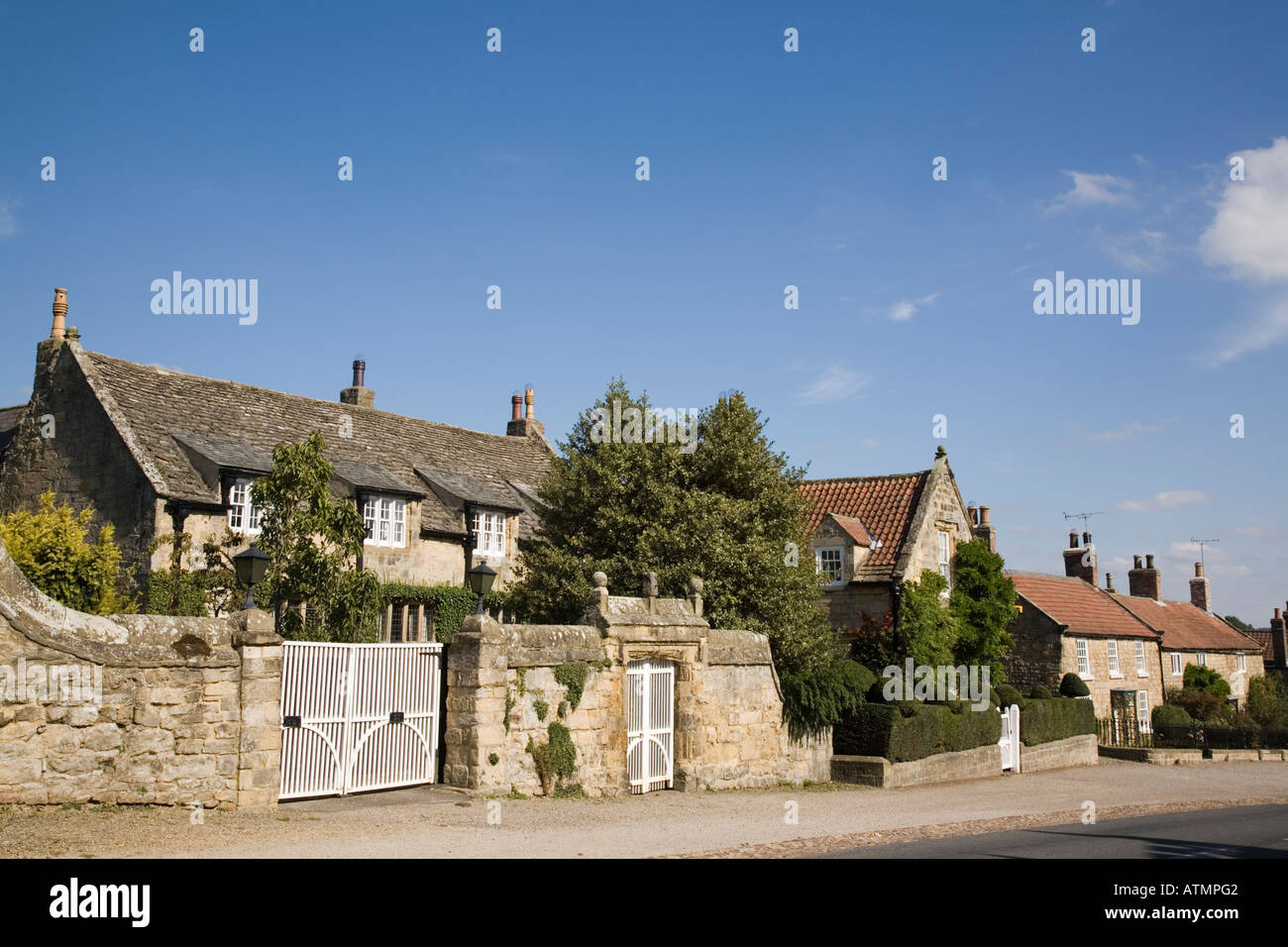 Traditional cottages on main street in peaceful picturesque village Coxwold North Yorkshire England Stock Photo