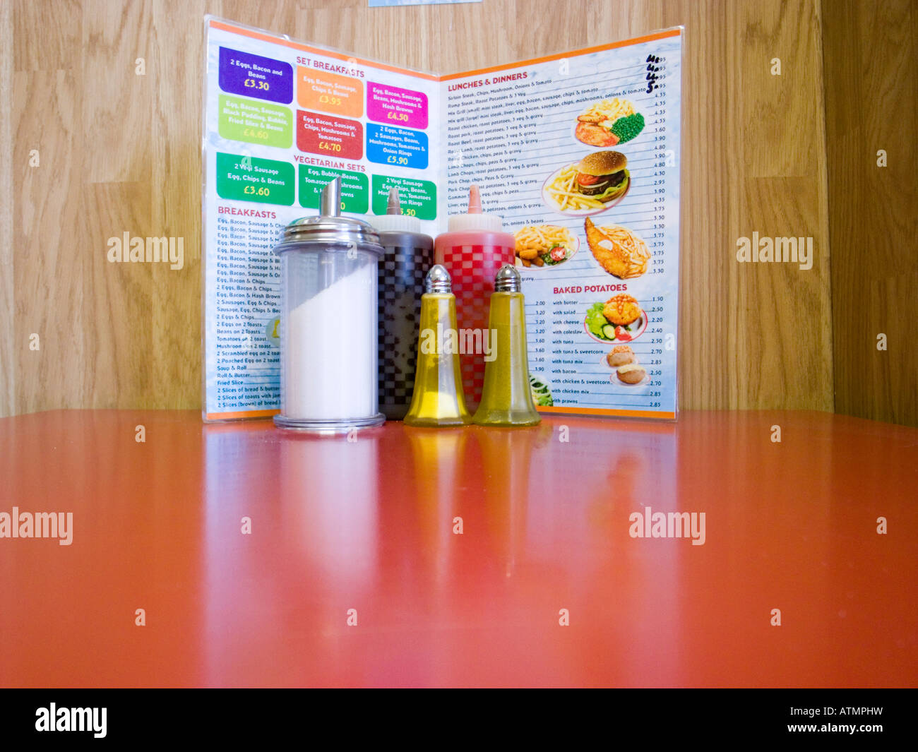 Condiments and menu in traditional cafe England UK Stock Photo Alamy