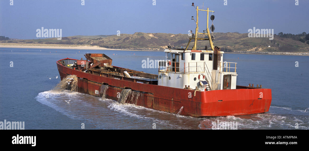 A dredger clears the shipping channel off Padstow in the Camel estuary Cornwall England Stock Photo