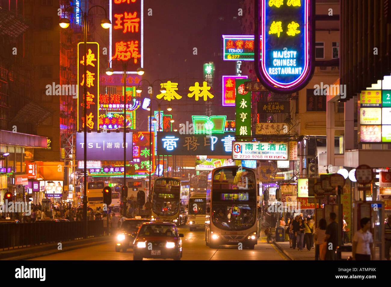 HONG KONG CHINA Neon lights and traffic on Nathan Road at night in Kowloon Stock Photo