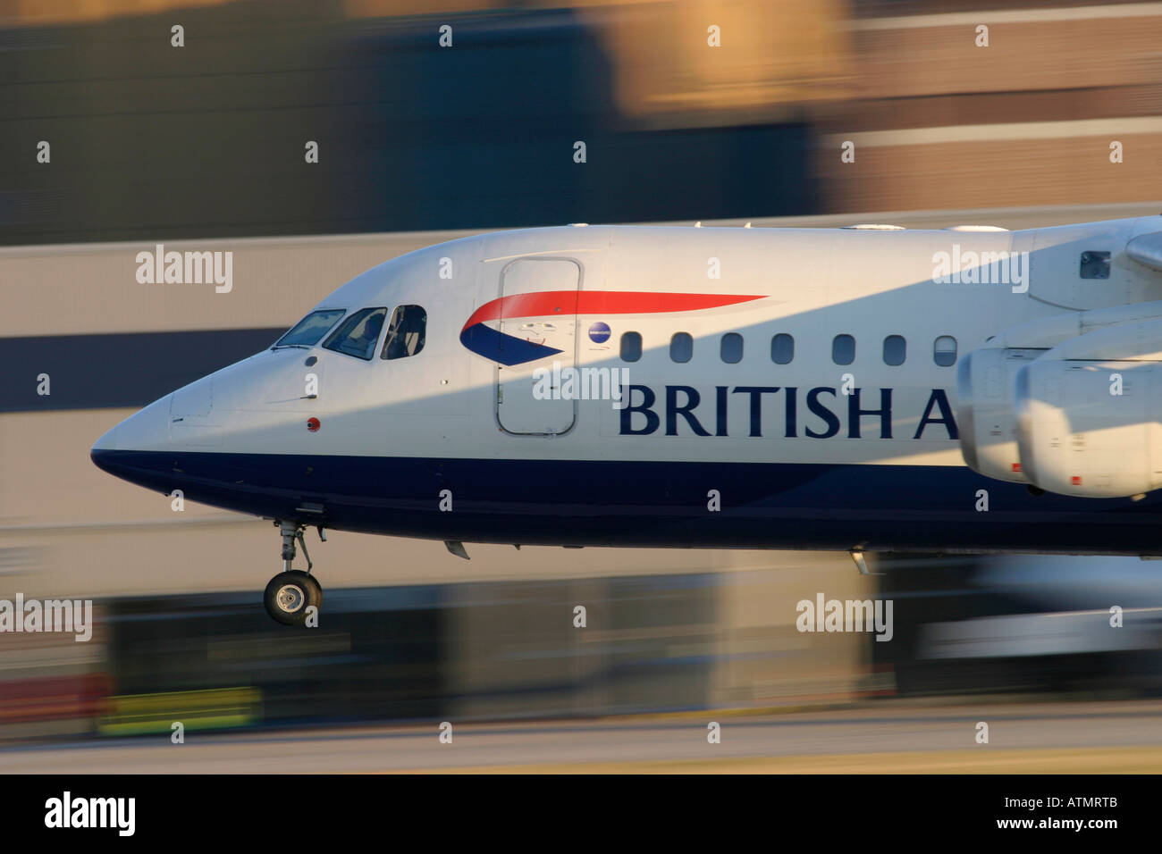 British Airways British Aerospace BAe-146-200A landing at London City Airport UK Stock Photo