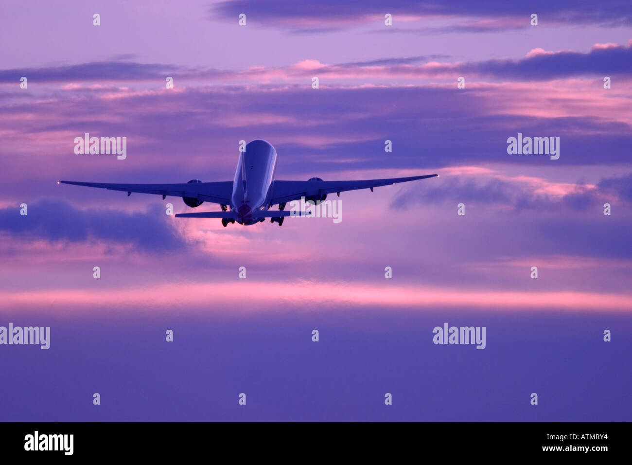 Passenger aircraft in flight Stock Photo - Alamy