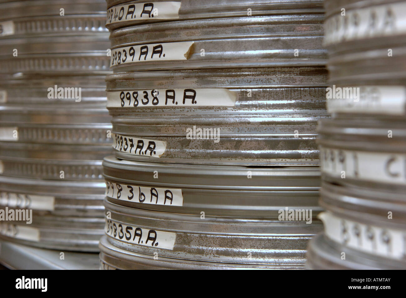 Celluloid film canisters. Stacked high in archive storage, Close up. Stock Photo