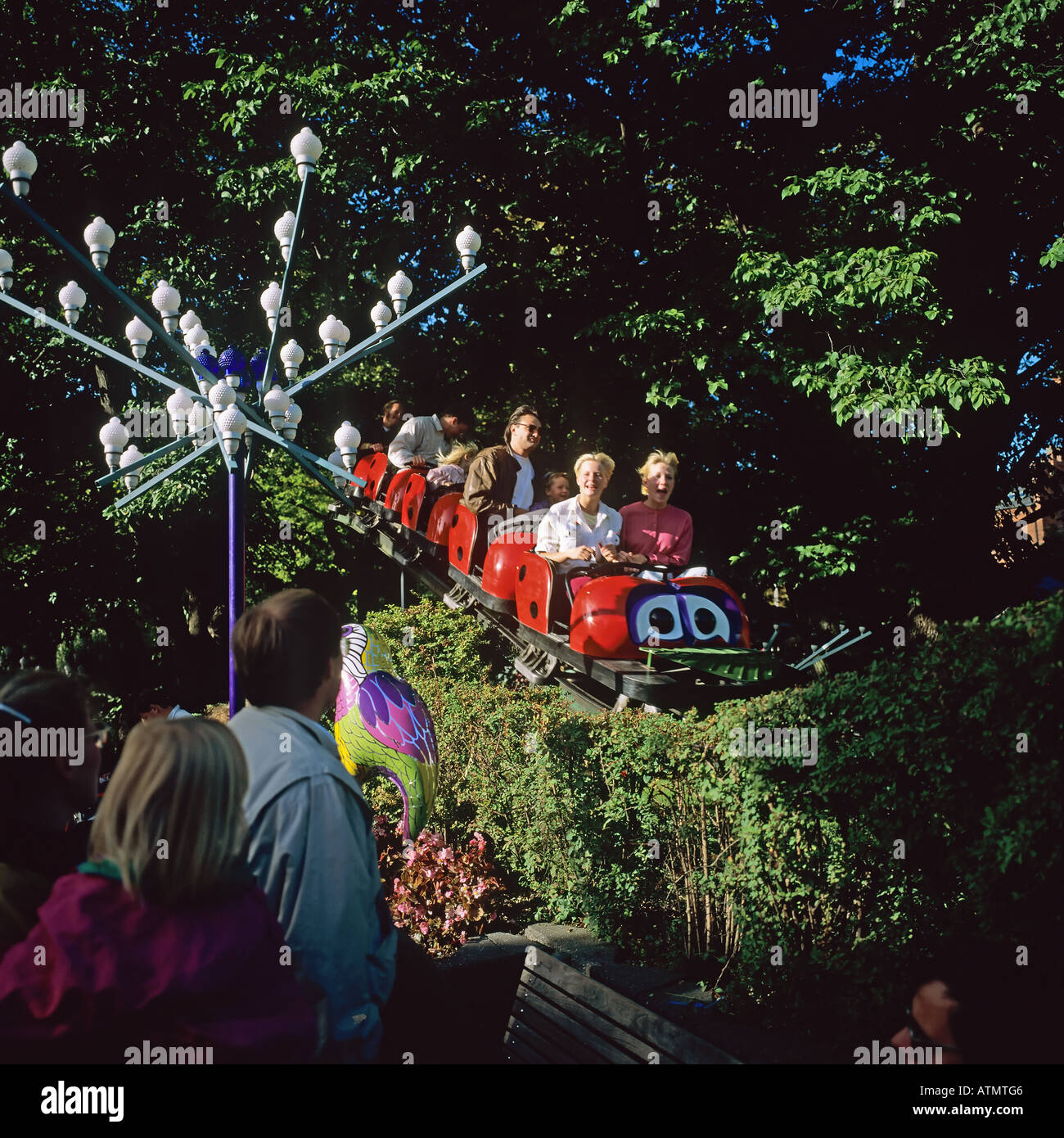 Roller coaster ride, Tivoli gardens amusement park, Copenhagen, Denmark Stock Photo