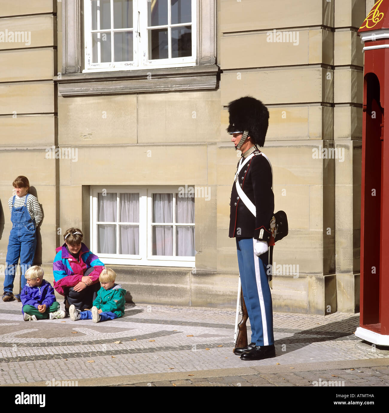 Royal guard, woman with children at Amalienborg palace, Copenhagen, Denmark, Europe Stock Photo