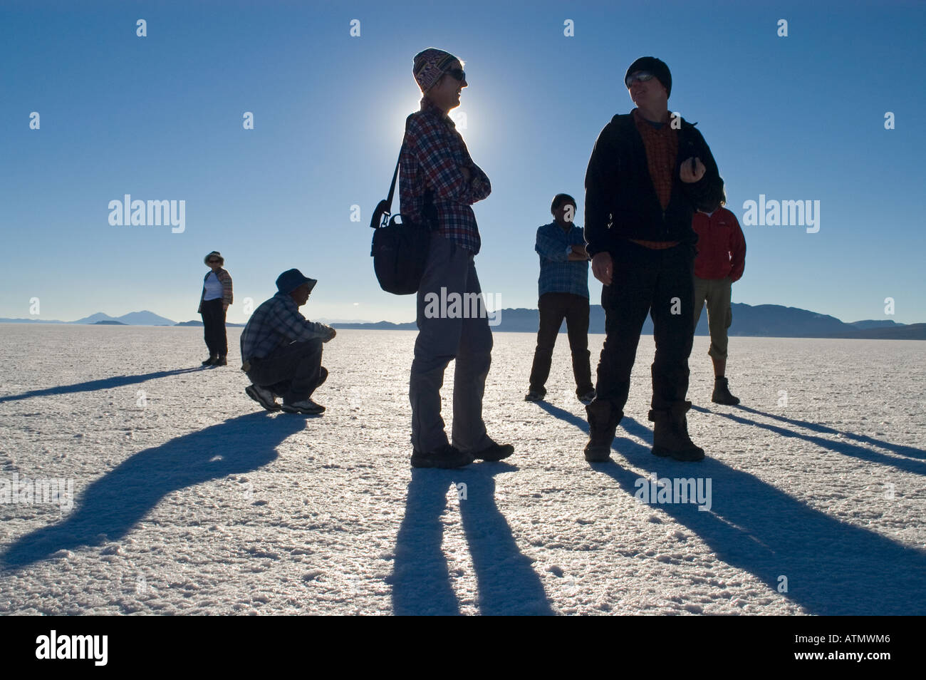 tourists on the Salar de Uyuni Bolivia Stock Photo