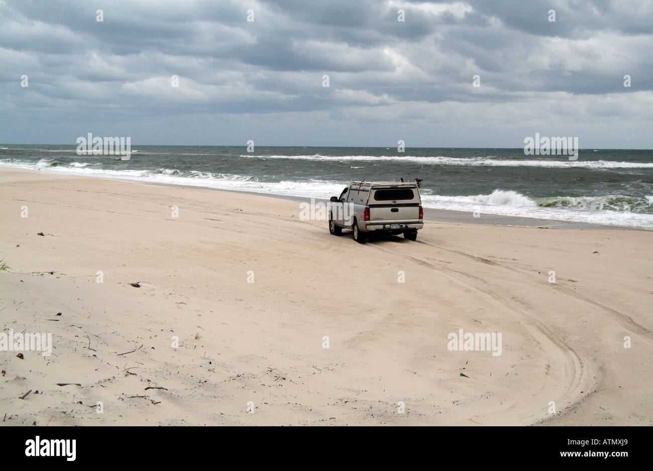4X4 vehicle driving on beach at Westhampton The Hamptons area of Long
