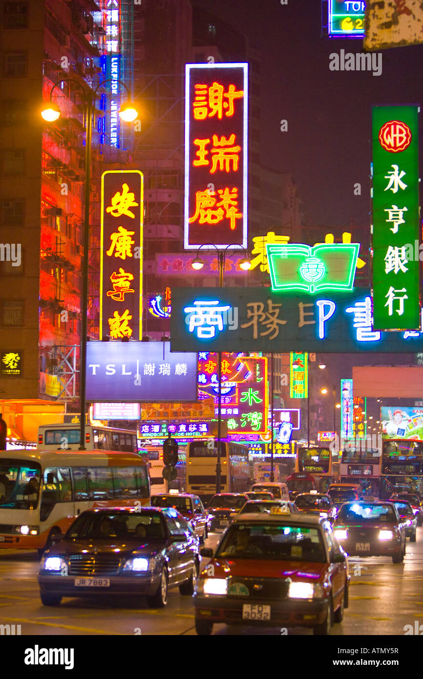 HONG KONG CHINA Auto traffic on Nathan Road at night in Kowloon. Neon lights. Stock Photo