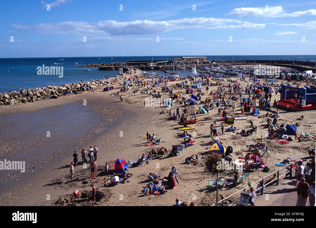 Lyme Regis The Cobb Beach Bank Holiday Dorset England Uk Gb Stock