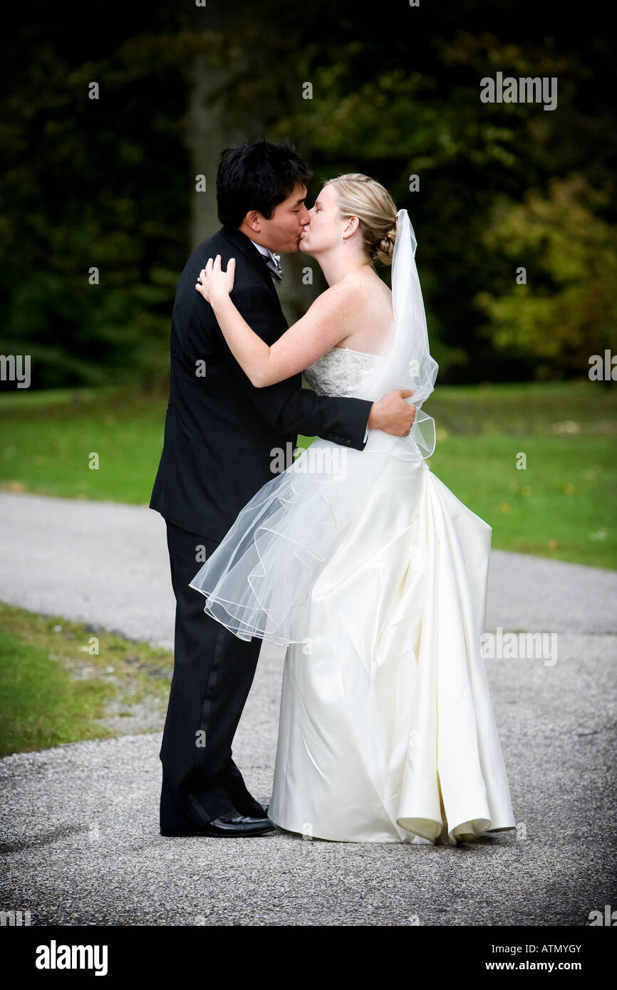 sweet kiss of the bride and groom during a wedding Stock Photo - Alamy