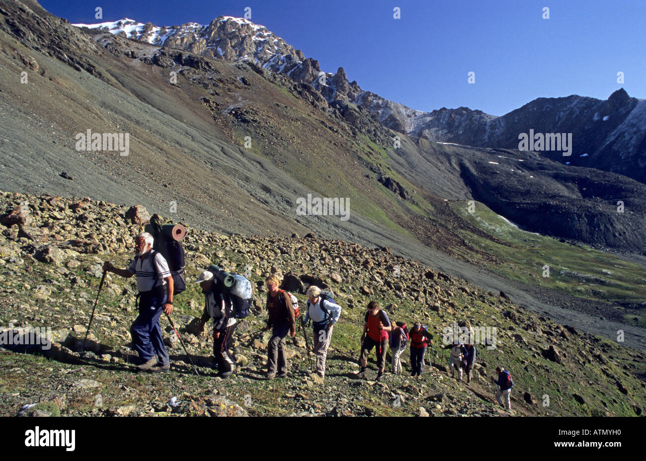 mountain climbers at Ala Kol Ala Kul Pass 3860 m Terskey Alatau Mountains Tian Shan Kyrgyzstan Stock Photo