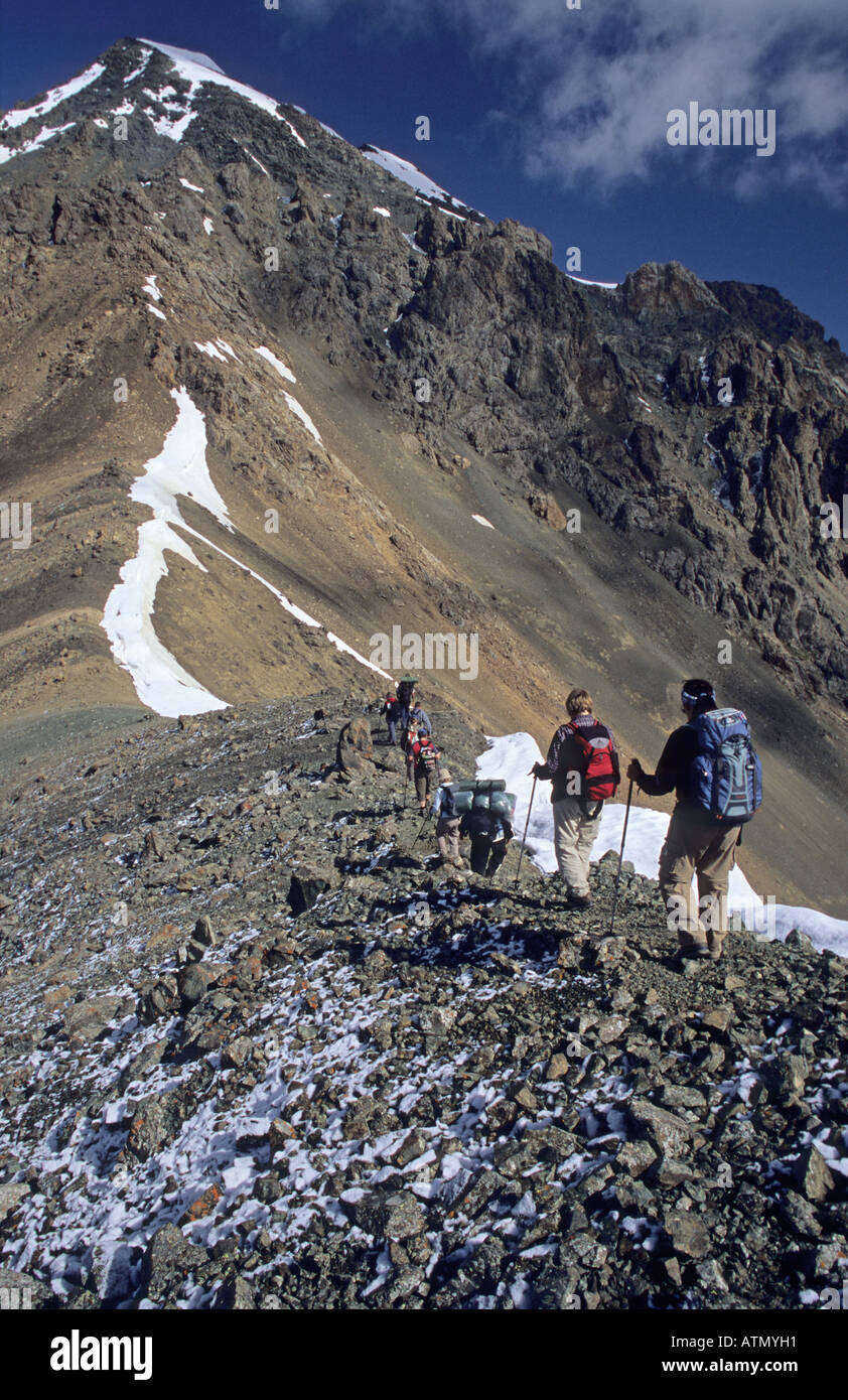 hikers at Ala Kol Ala Kul Pass 3860 m Terskey Alatau Mountains Tian Shan Kyrgyzstan Stock Photo