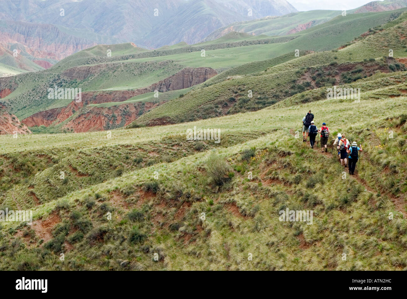 hikers at the upper Konorchek Canyon Kyrgyzstan Stock Photo