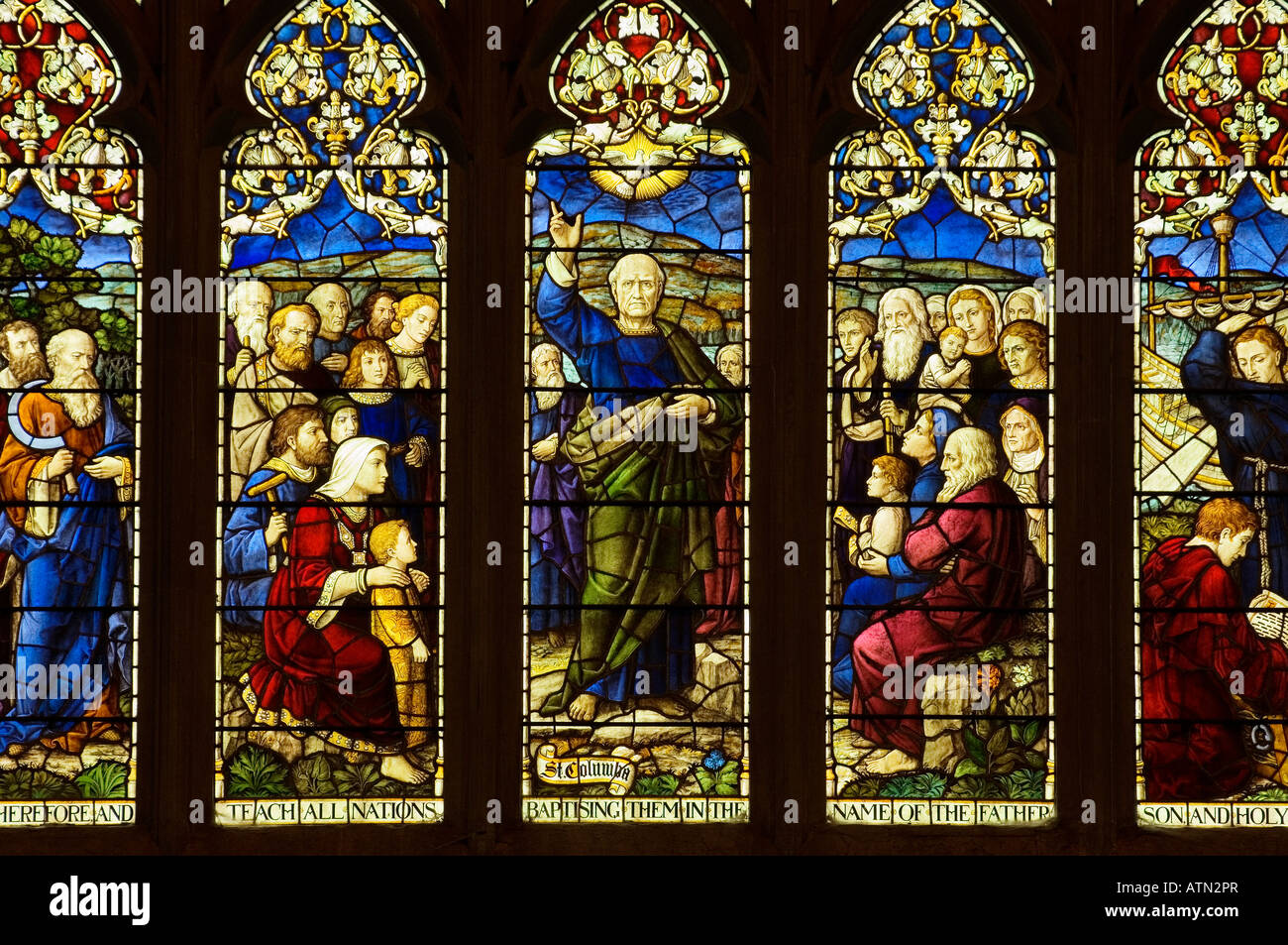 Section of the stained glass east window, dating from 1908, in Dunkeld Cathedral, Tayside, Scotland. St. Columba teaching Stock Photo